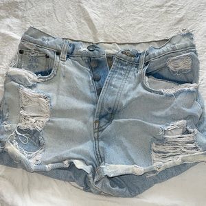 Car mark light wash ripped mid rise / high rise jean shorts
